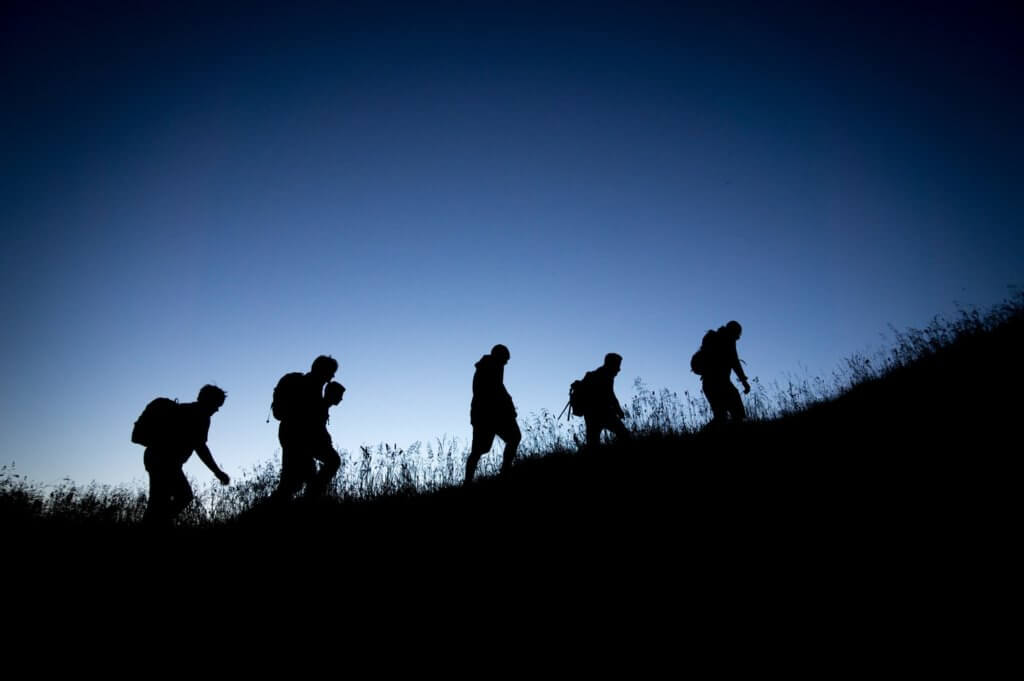a crowd following one person